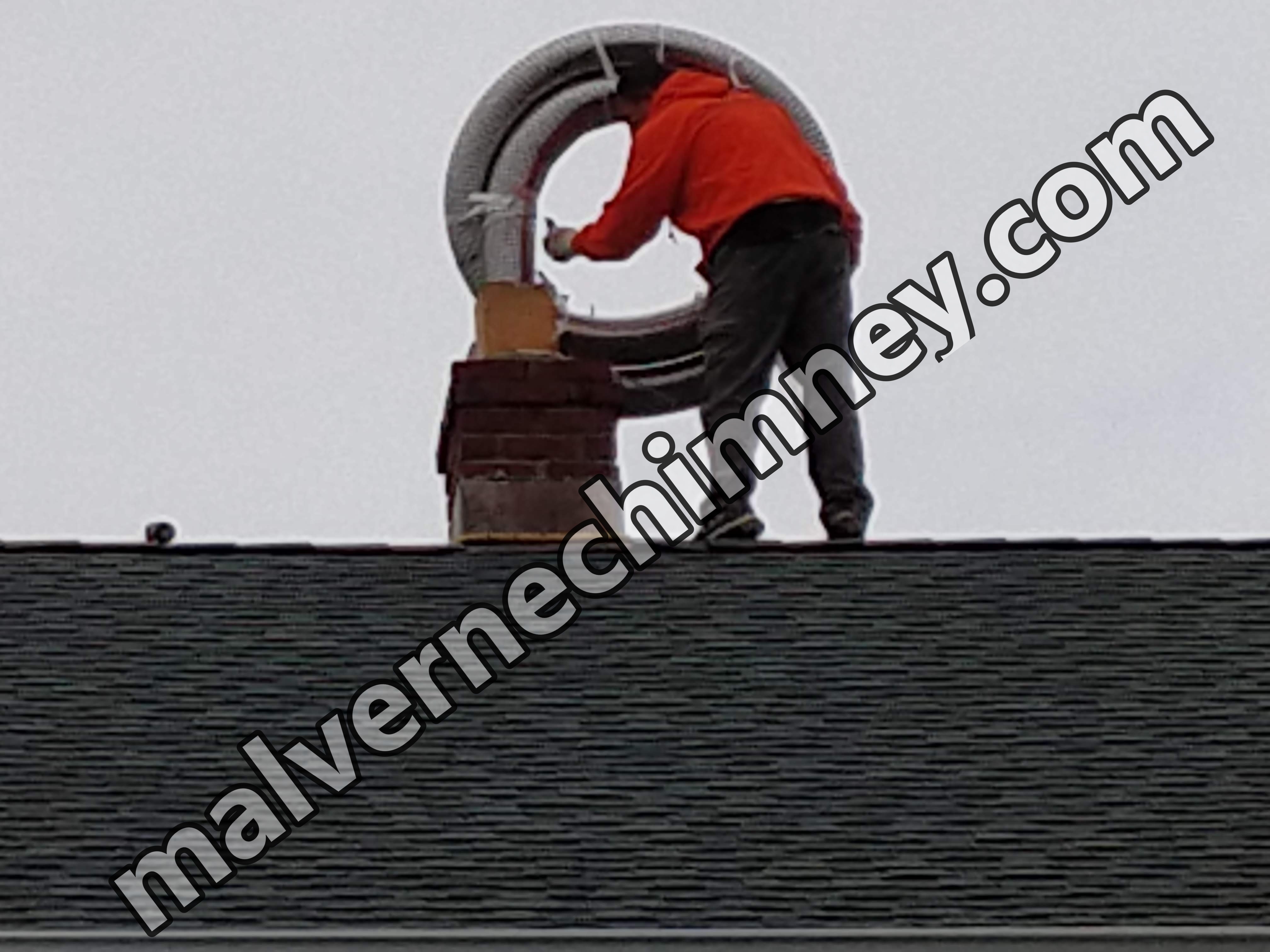 Flexible stainless chimney liner being installed in Malverne, New York